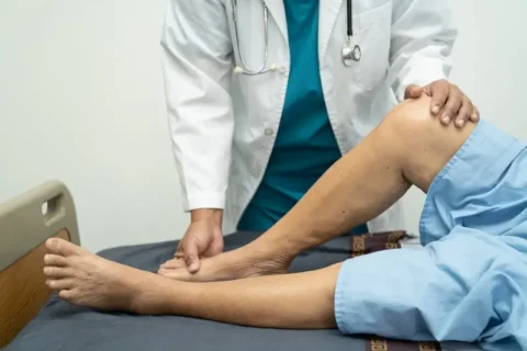 A patient with PAD getting an ankle-brachial index test