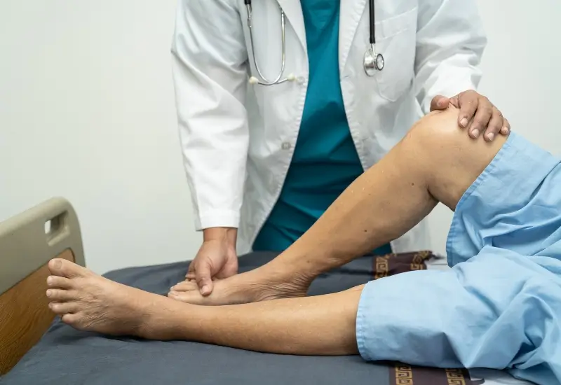 A patient with PAD getting an ankle-brachial index test